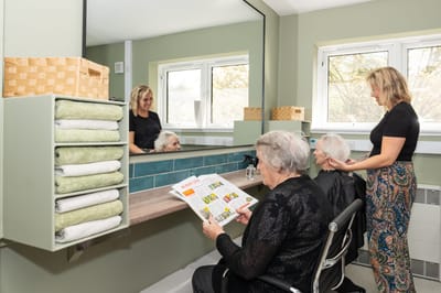 Residents enjoying a hair salon experience.