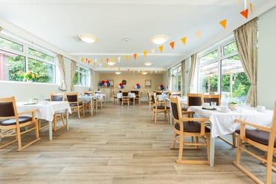 Bright dining area with tables and decorations
