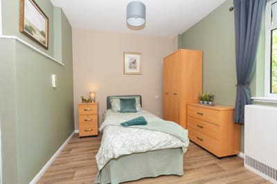 Cozy private room with bed and furniture