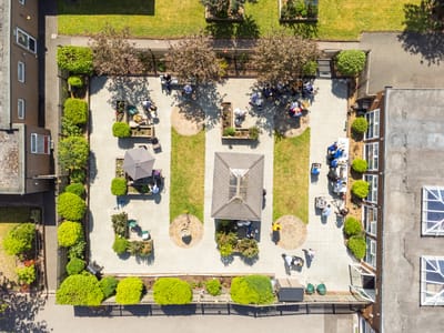 Aerial view of outdoor space with residents and staff.