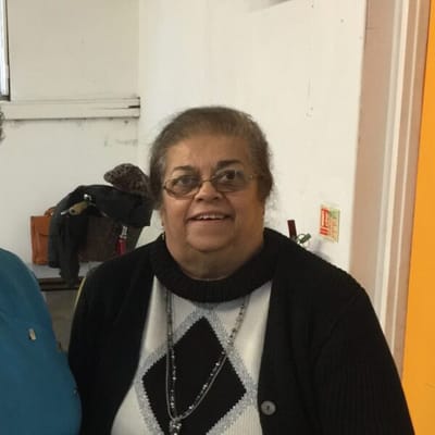 Resident smiling in an indoor setting