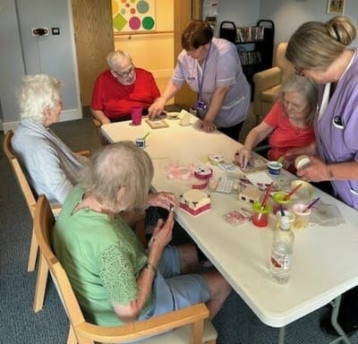 Residents engaging in a crafting activity together.