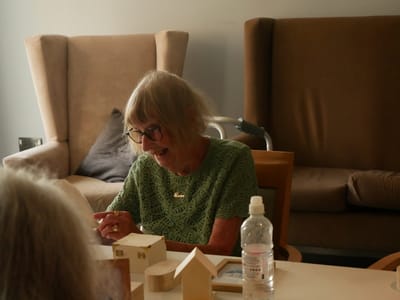 Senior woman engaged in a creative activity.