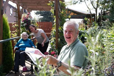 Residents enjoying a garden space together.