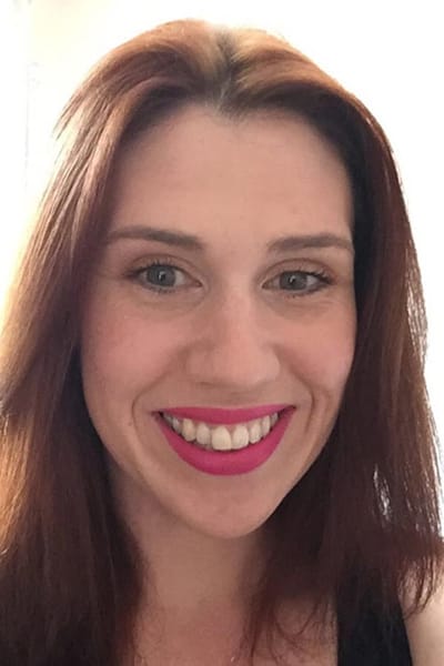 Smiling woman with bright lipstick