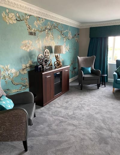 Comfortable seating area with floral decor.