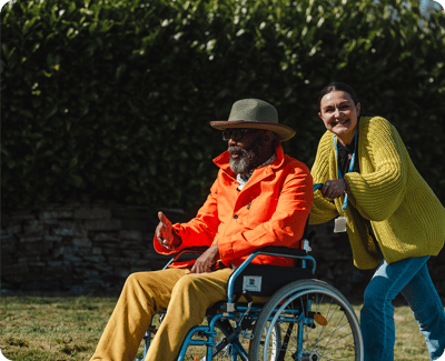 Resident enjoying time outside with staff member.