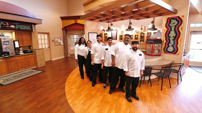 Staff posing in a common area of the facility