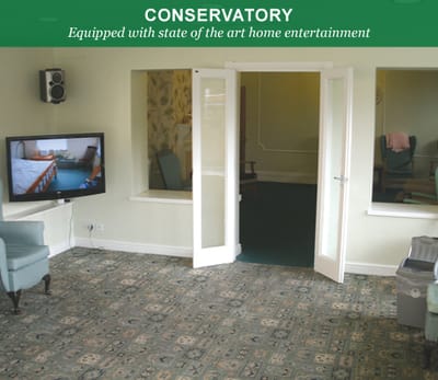 Interior view of a conservatory space with seating