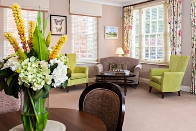 Cozy common area with comfortable seating and flowers