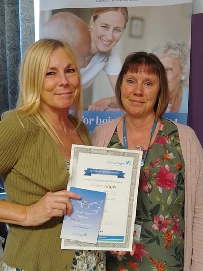 Staff members celebrating award recognition