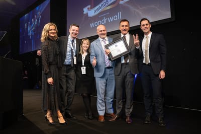 Group of people at an awards ceremony.