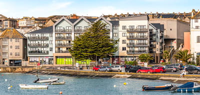 Exterior view of a waterfront building complex.