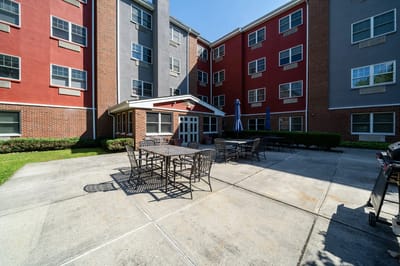 Outdoor patio area with seating and umbrellas.