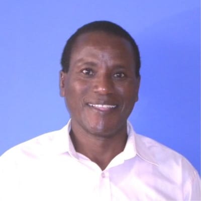 Smiling man in a blue background