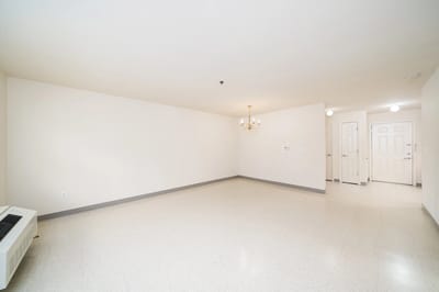 Empty resident room with beige walls and floor