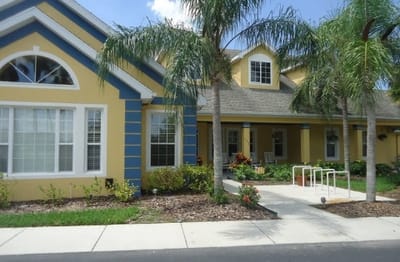 Exterior view of a senior living facility with landscaping