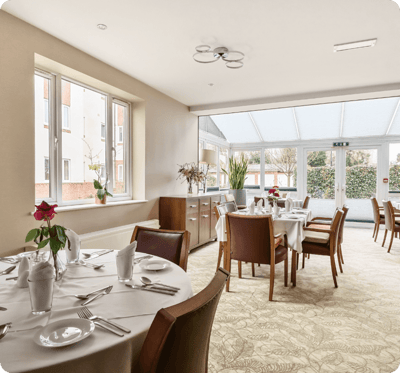 Dining room with tables set for a meal