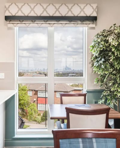 Bright interior view with a city skyline in the background