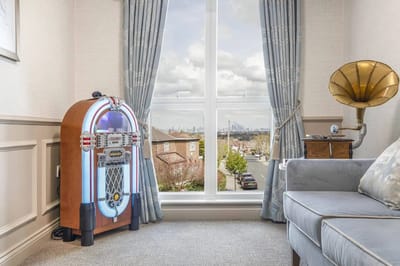 Cozy common area with a jukebox and city view