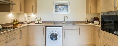 Well-equipped kitchen in a senior living unit