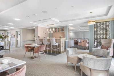 Bright common area with seating and bar