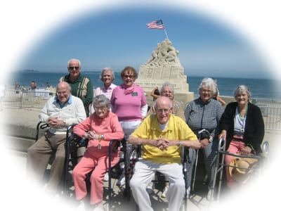 Bertram House of Swampscott, assisted living in Swampscott, MA — Seniors posing in front of a seaside monument