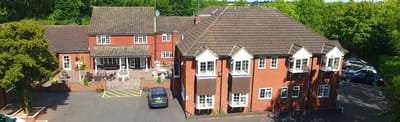 Aerial view of Bablake House showing the building and outdoor space.