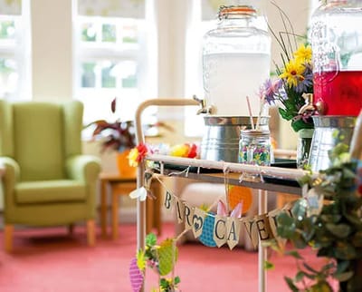 Decorative beverage cart in a bright common area