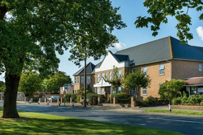 Exterior view of Cavell Lodge with landscaping