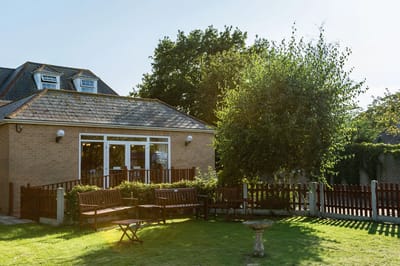 Outdoor space with seating and greenery