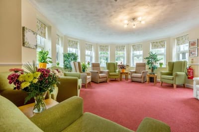 Bright common area with comfortable seating and plants