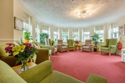 Bright common area with comfortable seating and plants