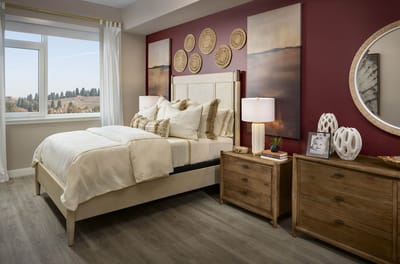 A well-decorated bedroom in a senior living facility