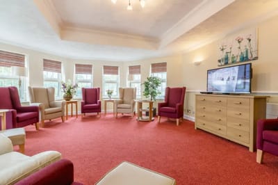 Bright common area with seating and television
