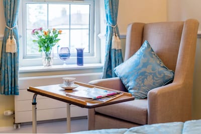 Comfortable resident room with a cozy chair