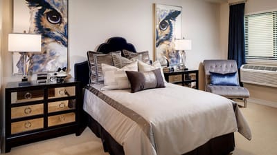 Stylish private resident room with a bed and art