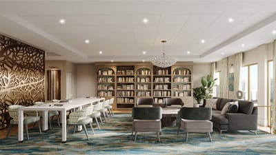 Spacious common area with seating and bookshelves
