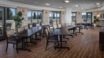 Bright common area with tables and chairs