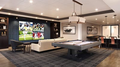 Interior view of a common area with pool table and screens