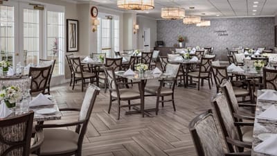 Elegant dining room with tables set for a meal