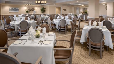 Elegant dining room setup with tables and chairs