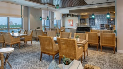 Bright dining area with seating and decor
