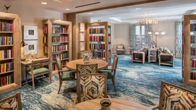 Common area with bookshelves and seating