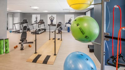 Interior view of a fitness room with exercise equipment