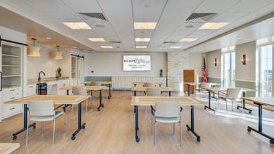 Bright common area with tables and chairs