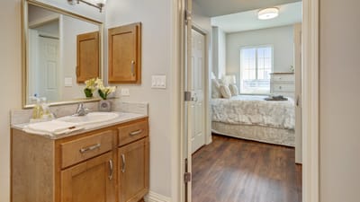 Stylish resident room with bathroom and bed