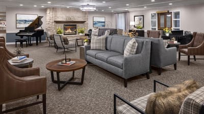 Comfortable lounge area with seating and a piano