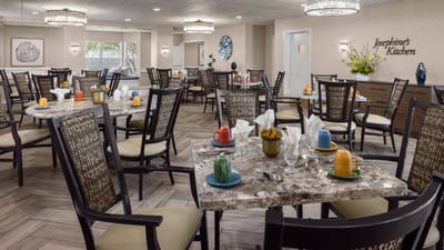 Dining room with set tables and colorful decor