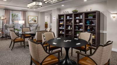 Common area with seating and bookshelves in the facility
